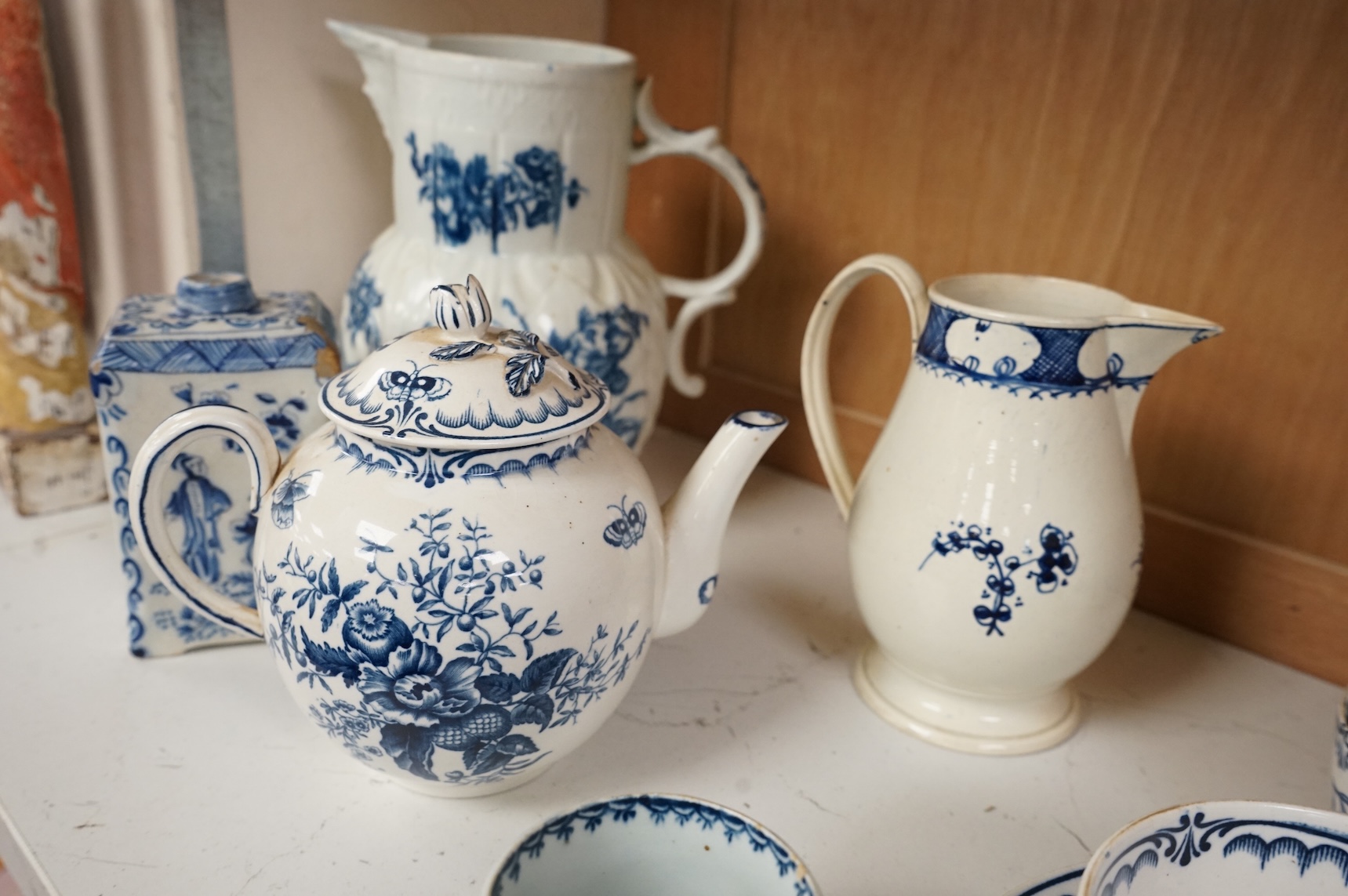 An 18th century blue and white Worcester jug and assorted Booths Worcester style tea wares, largest 24cm high
